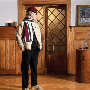 Woman standing in a warm cozy vintage Swiss chalet